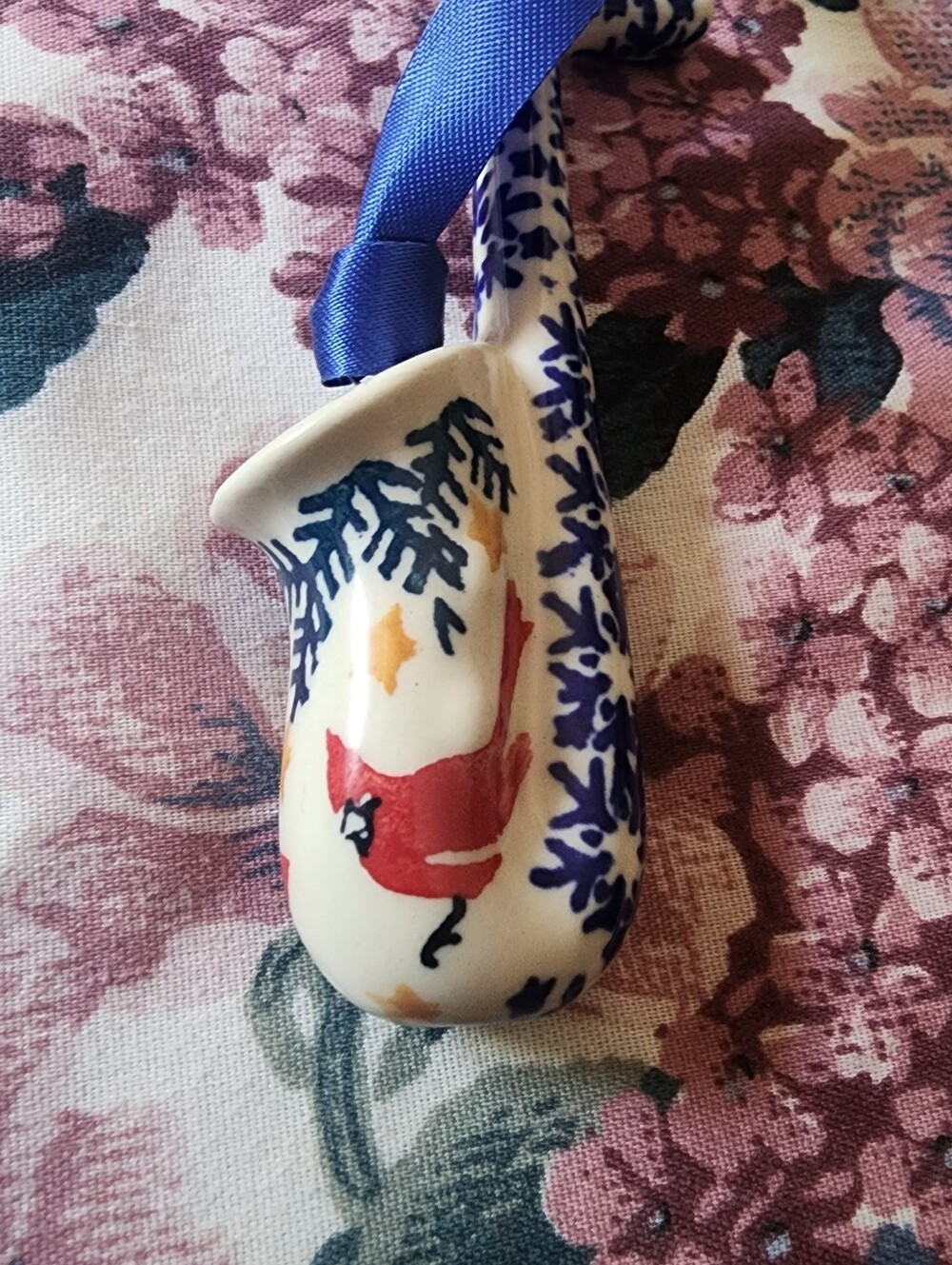 Boleslawiec Polish Pottery saxophone ornament with a red cardinal bird